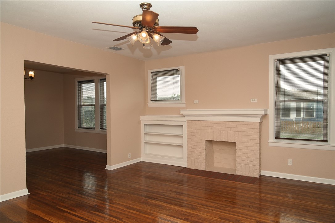 641 Naples Street Corpus Christi, TX 78404 - Photo 3 of 29 a view of an empty room with wooden floor and a window