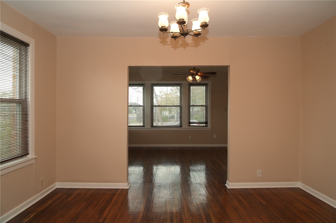 641 Naples Street Corpus Christi, TX 78404 - Photo 6 of 29 a view of empty room with wooden floor and fan