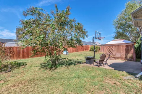 a view of a backyard with a patio