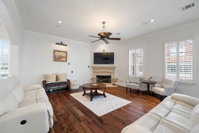 a living room with furniture fireplace and a flat screen tv