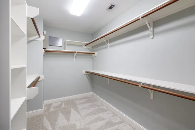 a view of an empty walk in closet