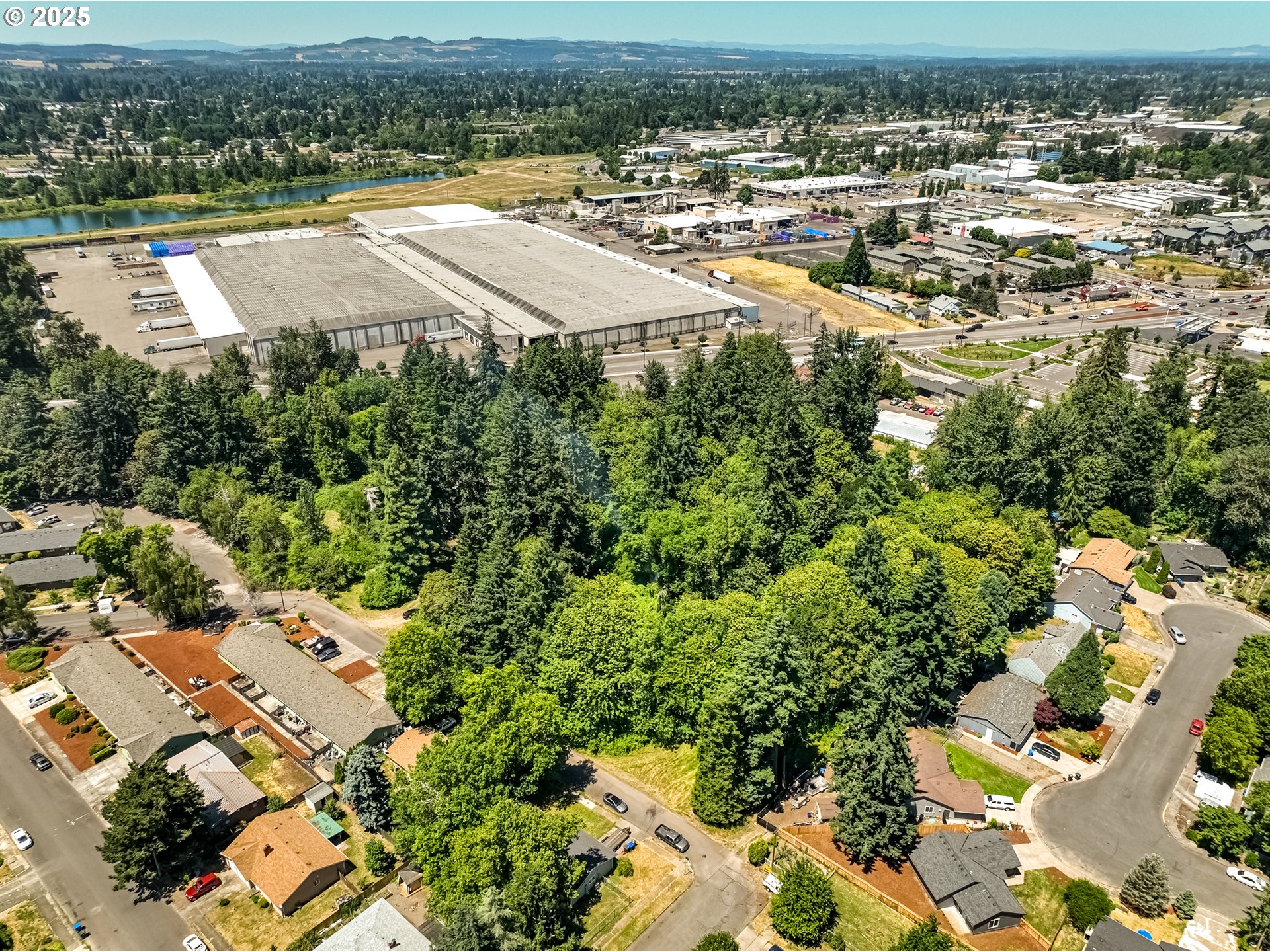 2557 Hummingbird Lane Northeast Salem, OR 97301 - Photo 5 of 7 an aerial view of residential houses with outdoor space and trees