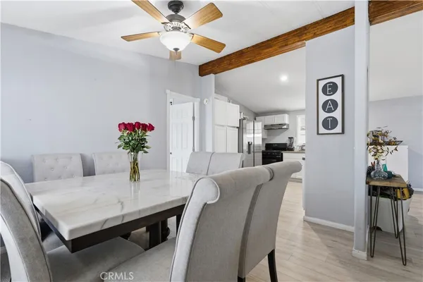 a dining room with furniture and window