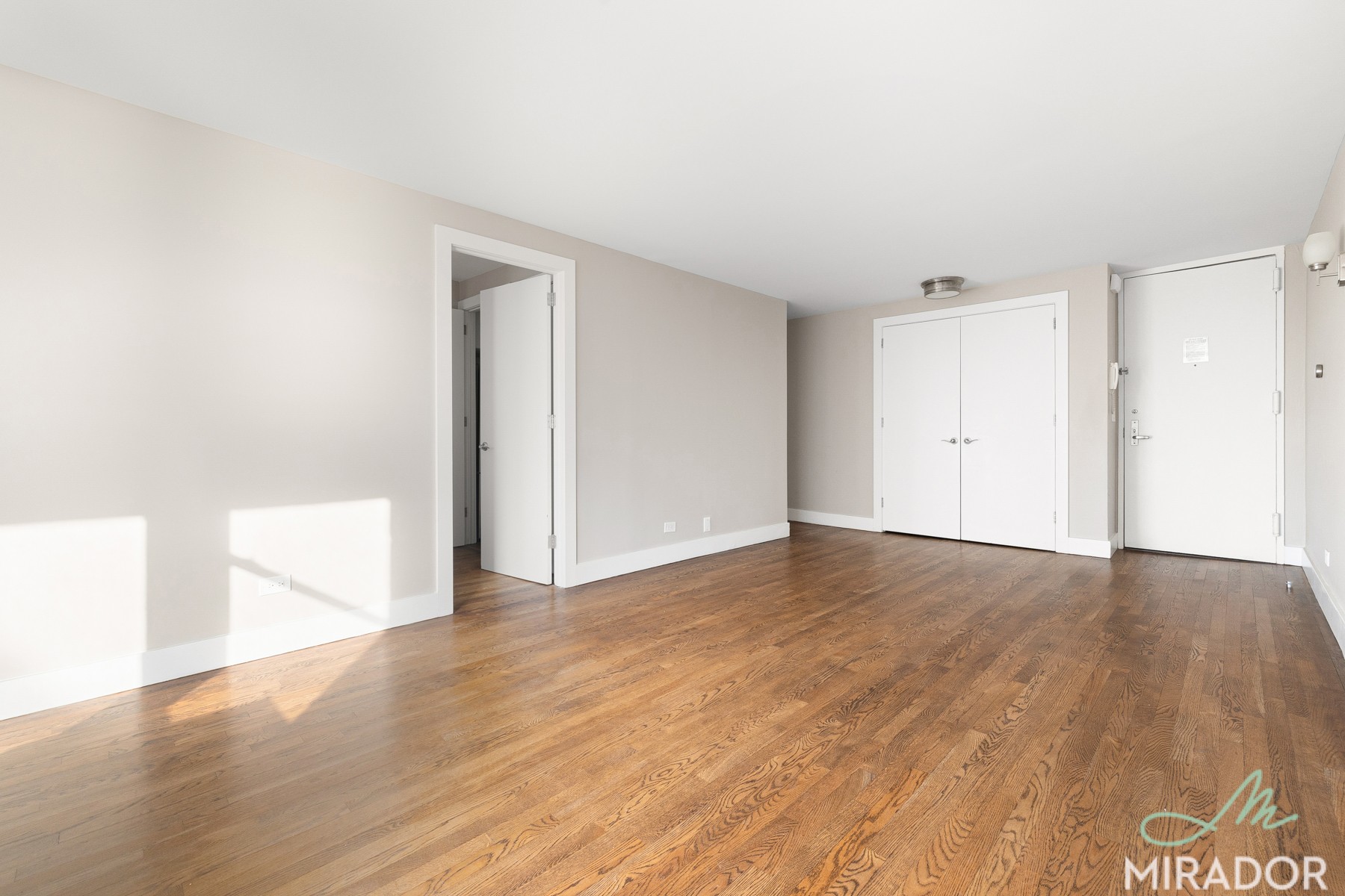 330 East 39th Street, Unit 15C Manhattan, NY 10016 - Photo 3 of 24 a view of an empty room and wooden floor