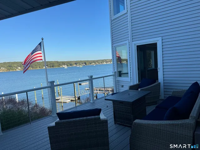 a view of living room and hall with wooden floor
