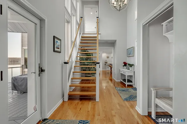 a kitchen with stainless steel appliances granite countertop a sink a stove and a refrigerator