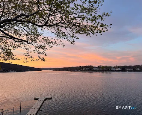 a view of lake and sunset