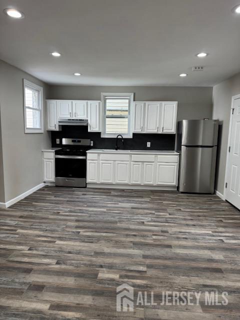 443 Fulton Street, Unit 2 Elizabeth, NJ 07206 - Photo 5 of 9 a kitchen with a refrigerator and a stove