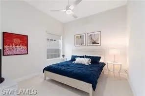 a spacious bathroom with a tub a double vanity sink and mirror