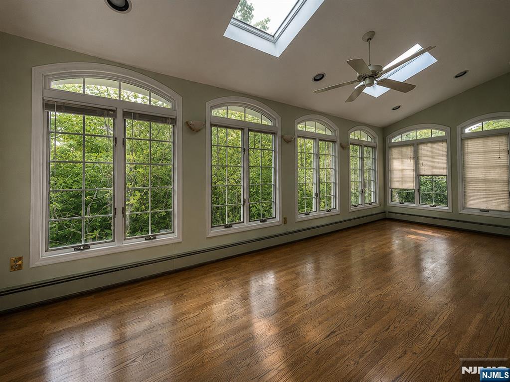 84 Valley View Avenue Ridgewood, NJ 07450 - Photo 7 of 20 a view of room with wooden floor and windows