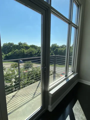 a view of a room with a large window