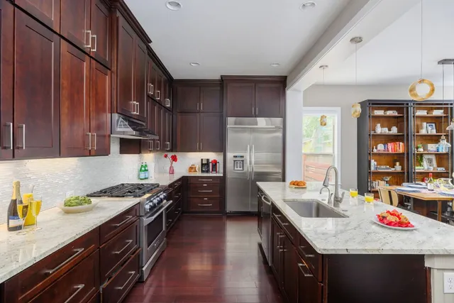 a kitchen with a cabinets and wooden floor