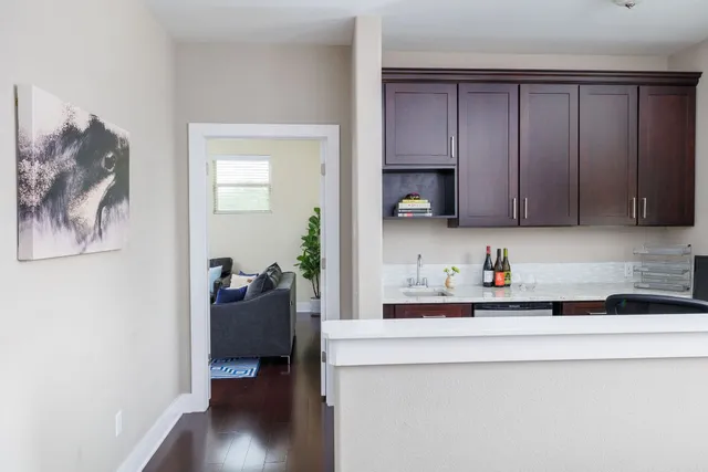 a kitchen with a sink cabinets and window