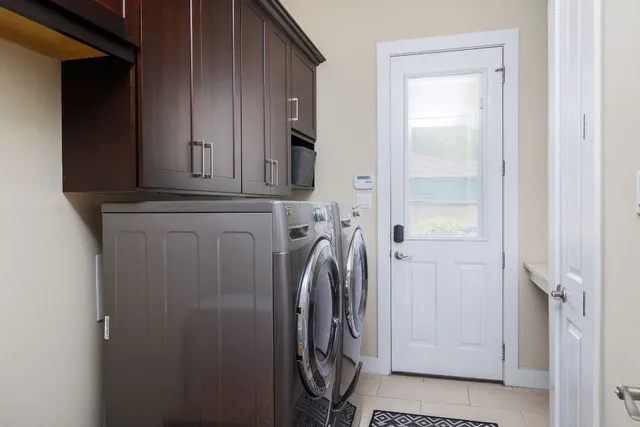 a view of a house with swimming pool and sitting area