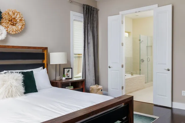 a bathroom with a bathtub and a shower