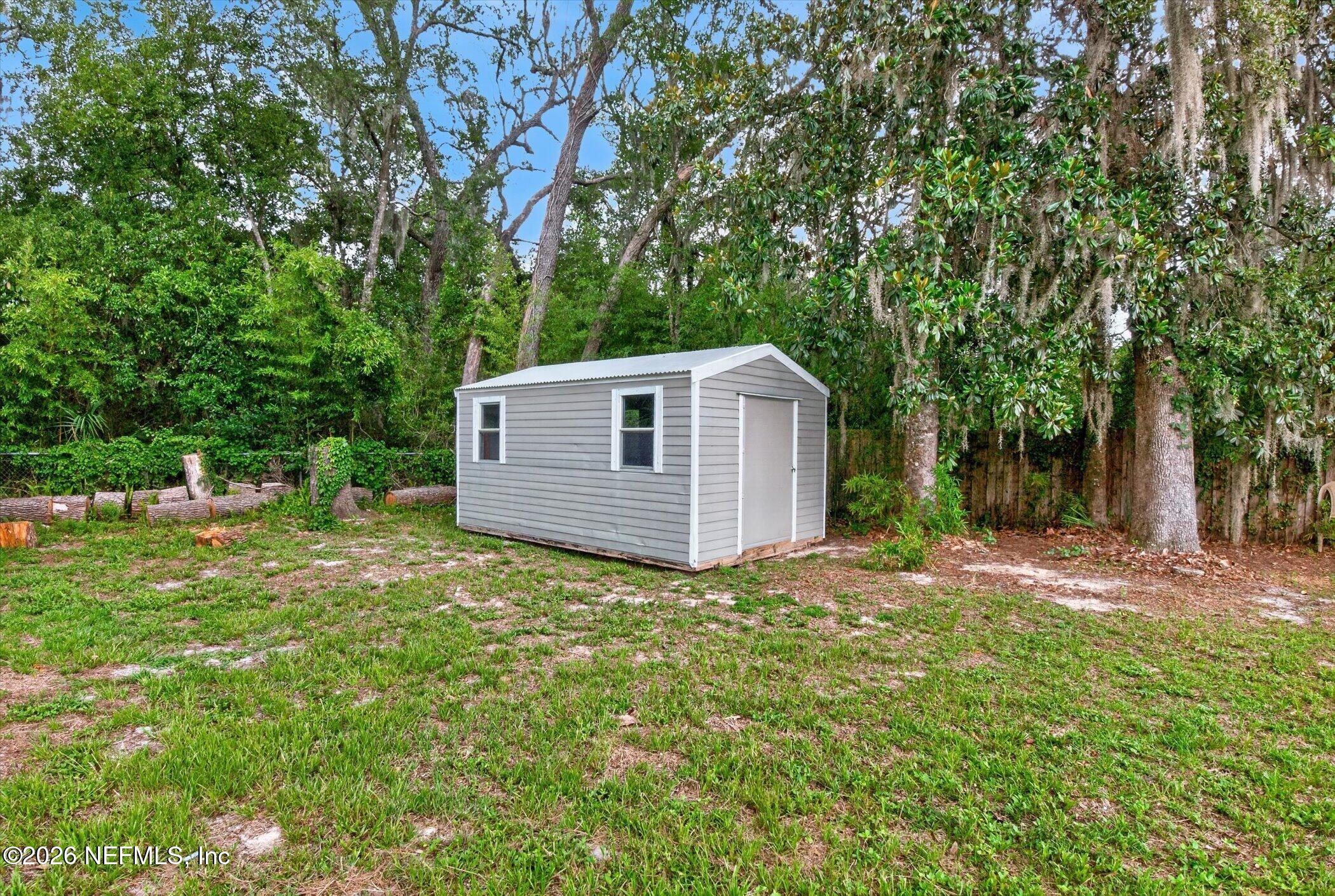 2705 Navajo Road Orange Park, FL 32073 - Photo 58 of 58 a view of a backyard with large trees