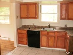 1256 Poplarwood Road Wind Gap, PA 18091 - Photo 4 of 21 a kitchen with stainless steel appliances granite countertop a sink and a window