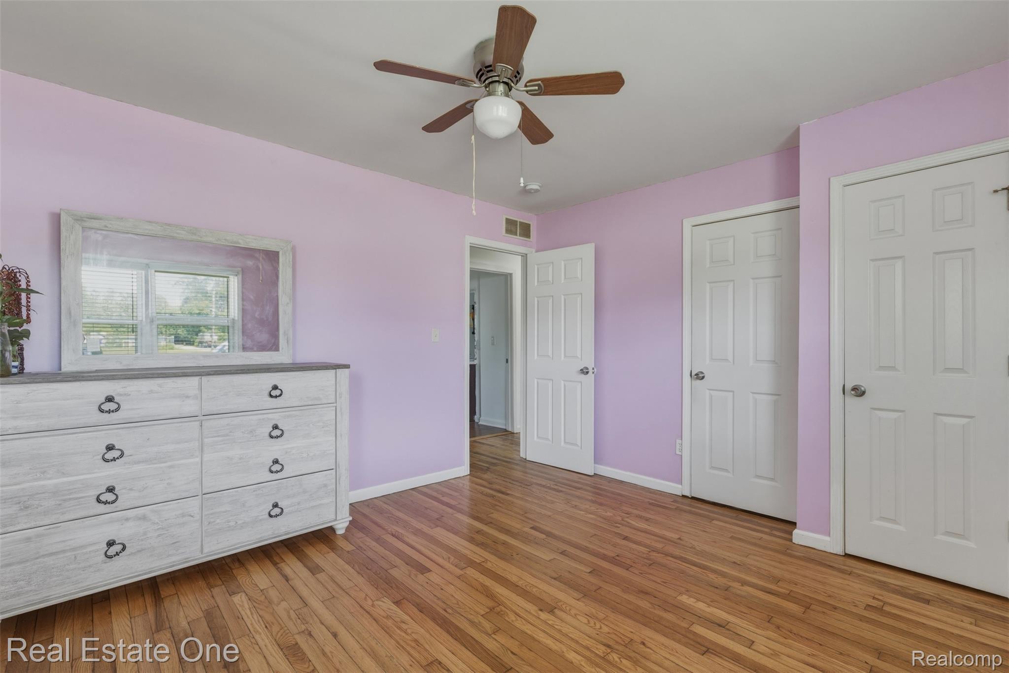 28151 Cherry Street Inkster, MI 48141 - Photo 13 of 18 Hardwood flooring throughout, two panel doors, and a ceiling fan with light fixture