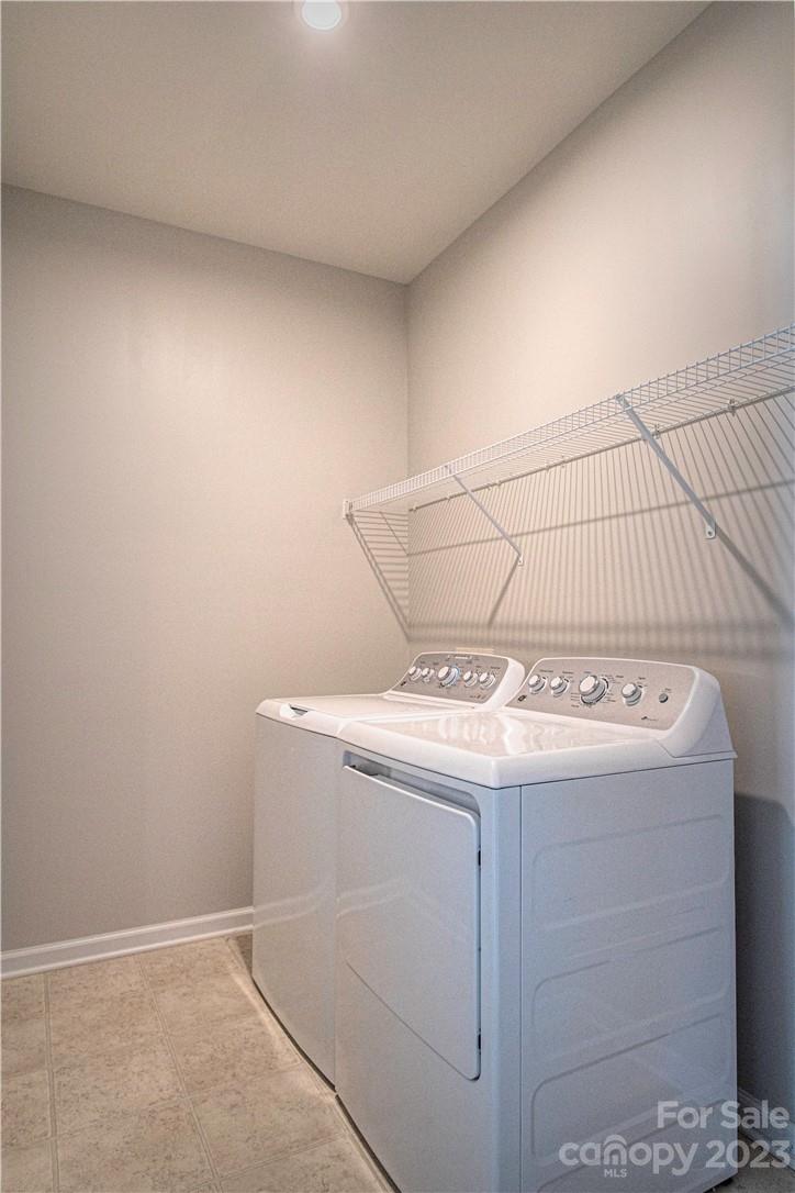 12725 Glowing Peak Road Huntersville, NC 28078 - Photo 13 of 17 a utility room with washer and dryer