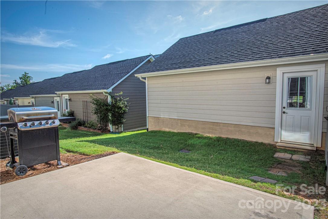 12725 Glowing Peak Road Huntersville, NC 28078 - Photo 14 of 17 a view of a house with a yard and garage