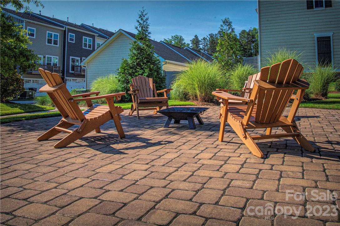 12725 Glowing Peak Road Huntersville, NC 28078 - Photo 16 of 17 a view of backyard with a table and chairs