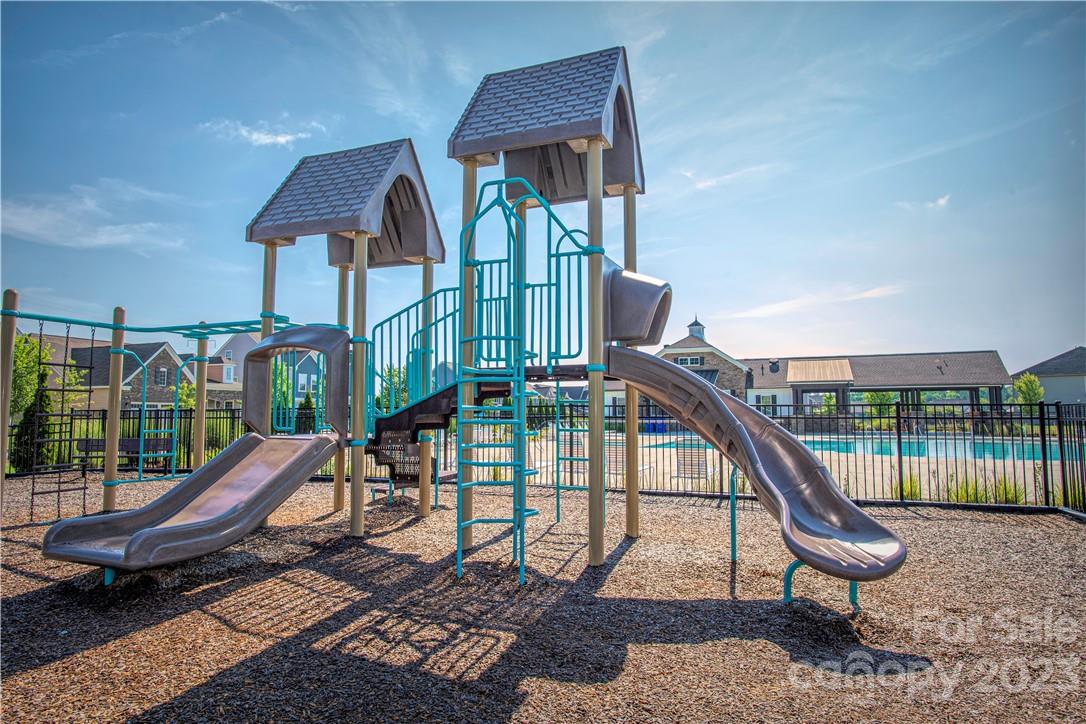 12725 Glowing Peak Road Huntersville, NC 28078 - Photo 17 of 17 a roof deck with table and chairs