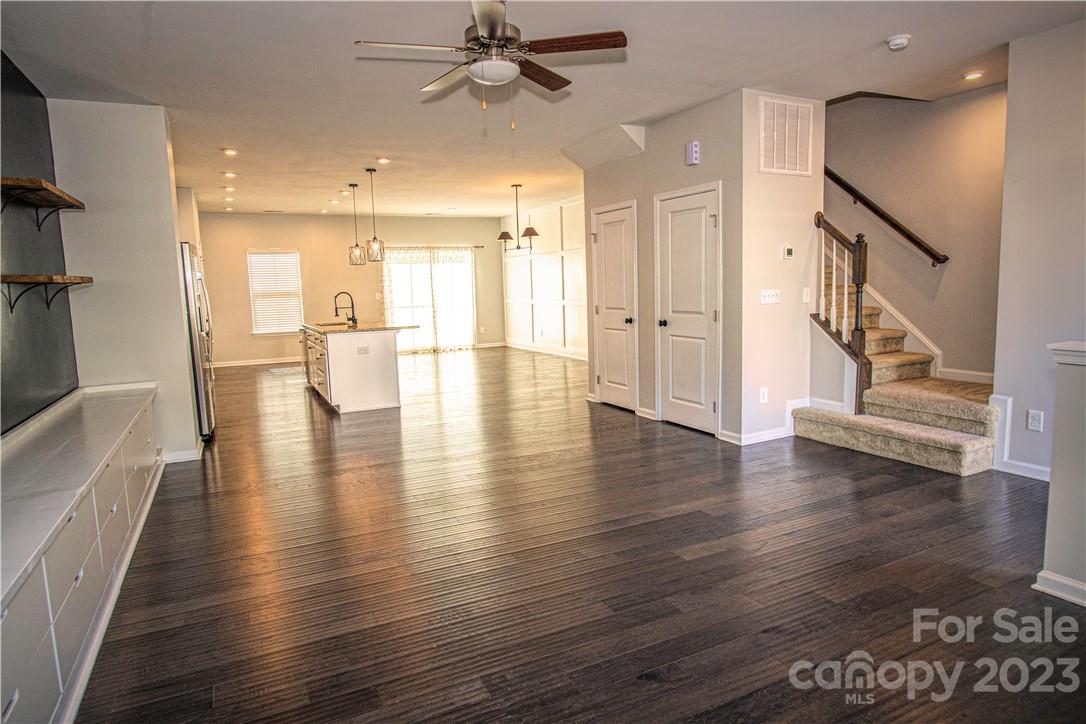 12725 Glowing Peak Road Huntersville, NC 28078 - Photo 3 of 17 an empty room with wooden floor and windows
