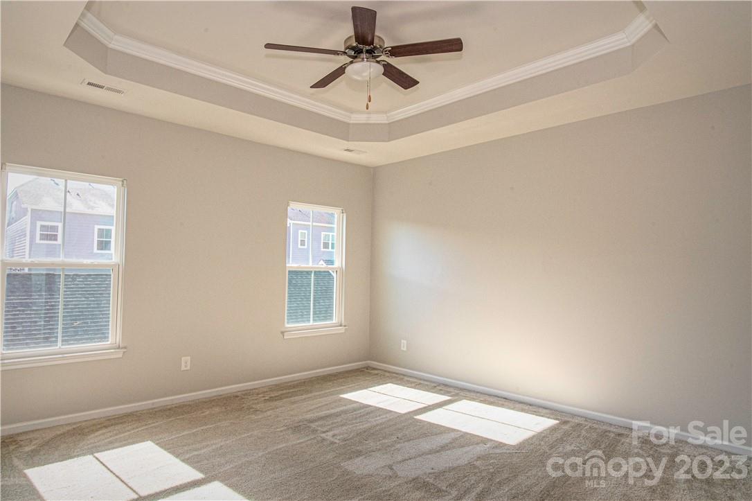 12725 Glowing Peak Road Huntersville, NC 28078 - Photo 6 of 17 an empty room with windows and fan