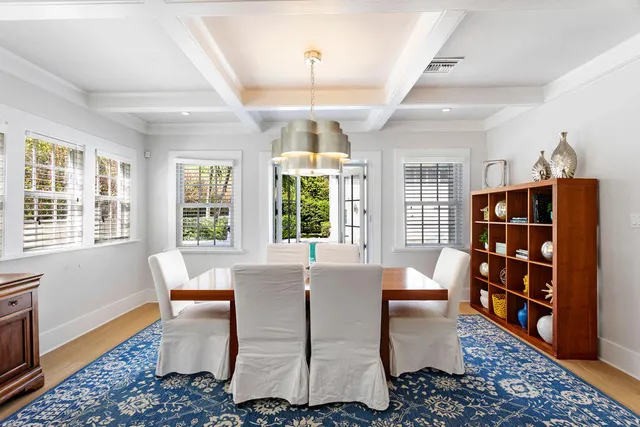 a living room with furniture a rug and a large window