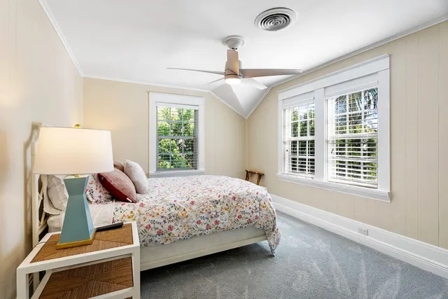 a bedroom with a bed and window