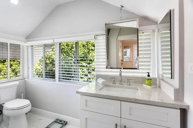 a bathroom with a sink and a window