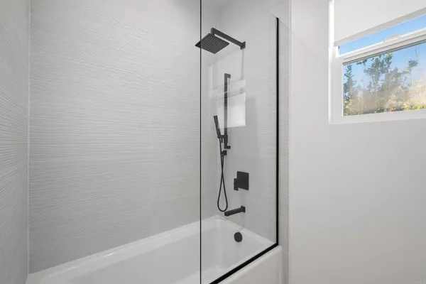 a view of a house with a swimming pool and a yard