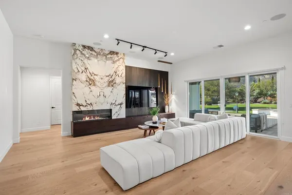 a living room with furniture and a large window