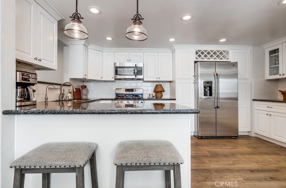 930 Ocean View Avenue, Unit E Monrovia, CA 91016 - Photo 11 of 36 a kitchen with stainless steel appliances granite countertop a sink a stove and cabinets