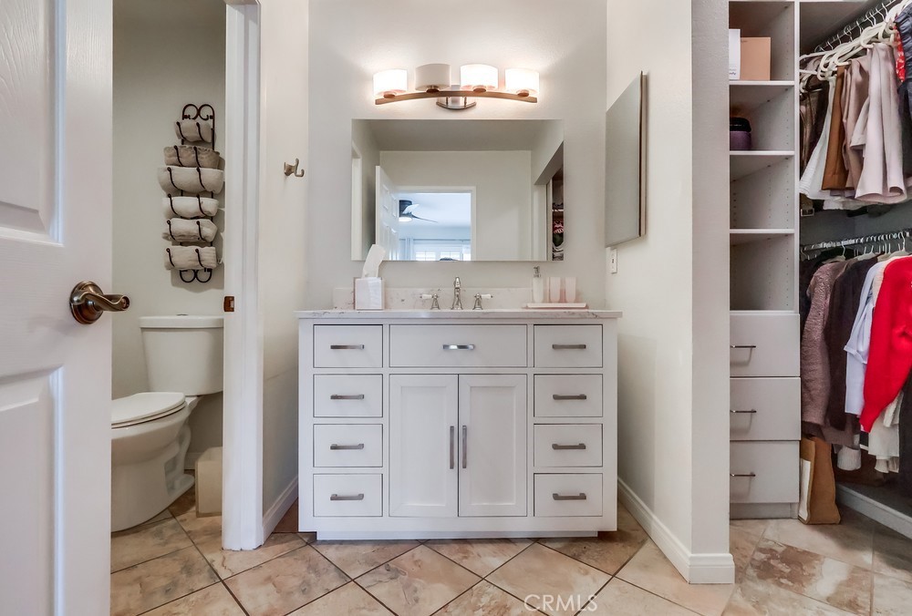 930 Ocean View Avenue, Unit E Monrovia, CA 91016 - Photo 19 of 36 a view of walk in closet with clothes and shoes