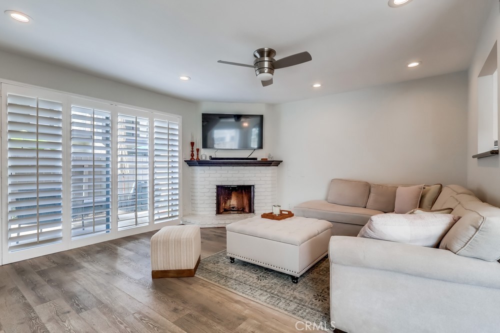 930 Ocean View Avenue, Unit E Monrovia, CA 91016 - Photo 7 of 36 a living room with furniture and a fireplace