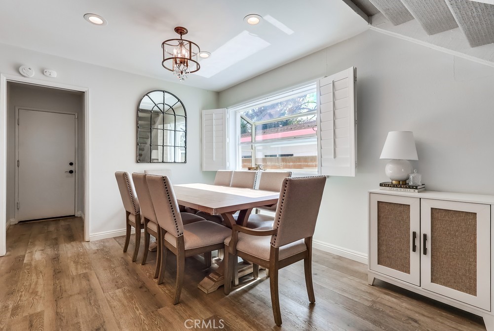 930 Ocean View Avenue, Unit E Monrovia, CA 91016 - Photo 9 of 36 a view of a dining room with furniture window and wooden floor