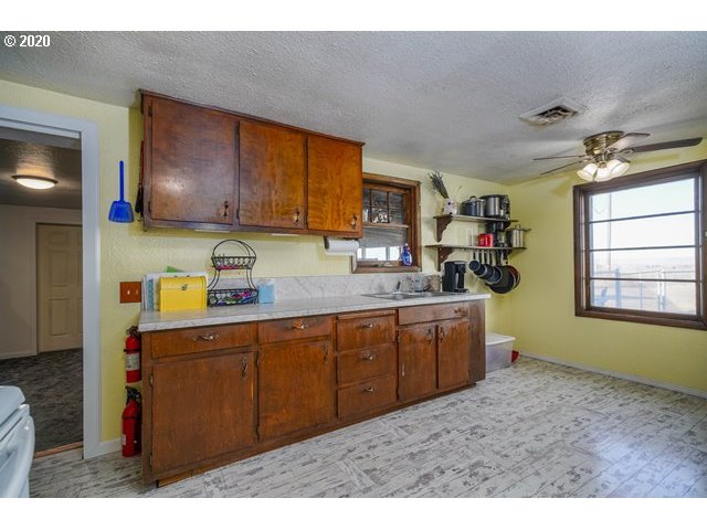 33554 County 1252 Road Hermiston, OR 97838 - Photo 4 of 26 a kitchen with sink cabinets and window