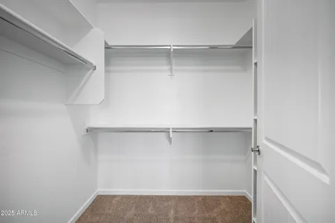 a bathroom with a granite countertop sink double and mirror