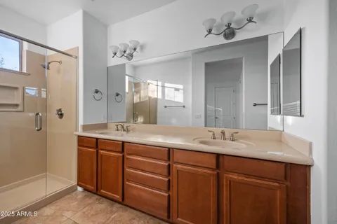 a bathroom with a shower and a sink