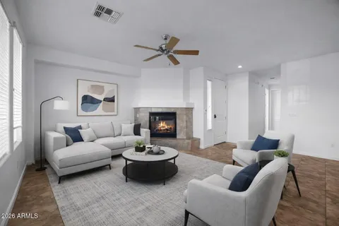 a living room with furniture and a fireplace