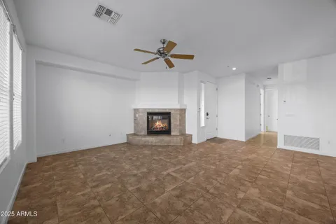 a view of empty room with a fireplace