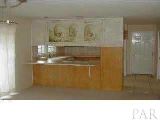 2021 Galt Road Pensacola, FL 32503 - Photo 2 of 6 spacious kitchen with breakfast bar overlooking rear yard.