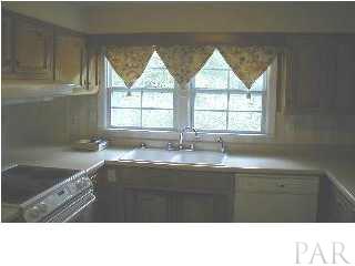 2021 Galt Road Pensacola, FL 32503 - Photo 3 of 6 kitchen overlooking rear yard