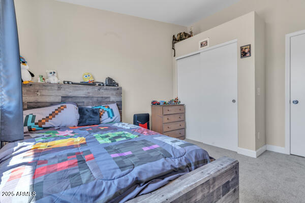 138 North Signal Butte Road Apache Junction, AZ 85120 - Photo 11 of 25 a bedroom with bed and wooden floor