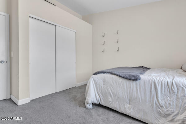 138 North Signal Butte Road Apache Junction, AZ 85120 - Photo 12 of 25 a bedroom with a bed and a window