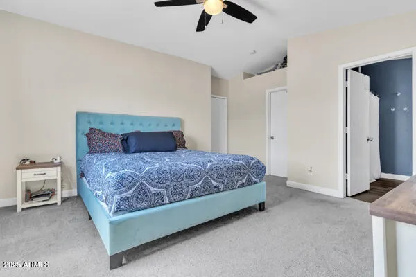 a bedroom with a bed and cabinets