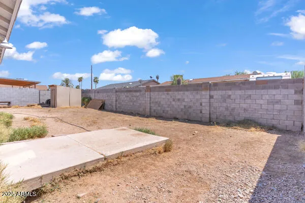 a view of a backyard of the house