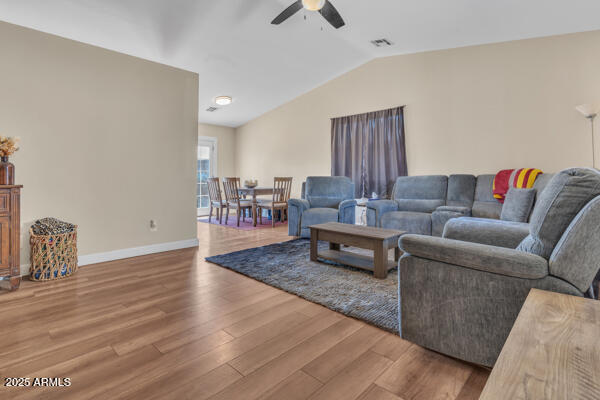 138 North Signal Butte Road Apache Junction, AZ 85120 - Photo 6 of 25 a living room with furniture and a wooden floor