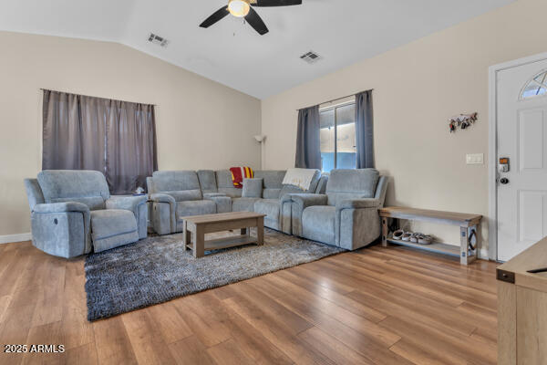 138 North Signal Butte Road Apache Junction, AZ 85120 - Photo 7 of 25 a living room with furniture and a wooden floor